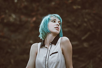 Woman with Blue Hair Looking Up Outdoors