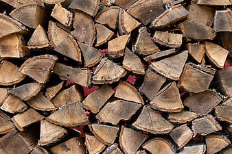 Stack of Split Firewood Logs Background