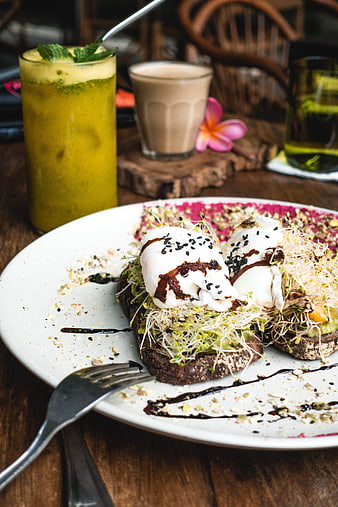 Healthy brunch toast with poached eggs and sprouts
