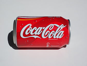 Coca-Cola Can Lying Down On White Background