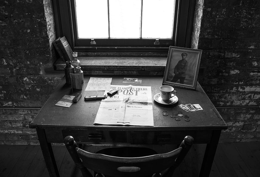 Historical WWI Soldier Desk Setup With Flanders Fields Post Newspaper