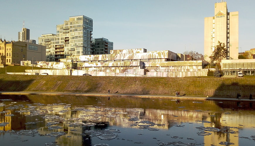 Modern cityscape with river ice and contemporary architecture