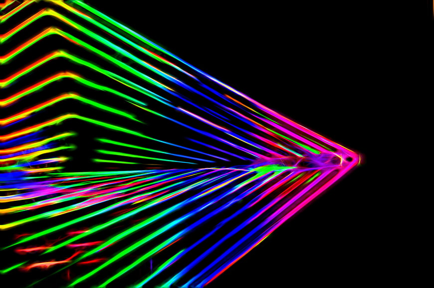 Vibrant Neon Light Trails Abstract Pattern On Black Background