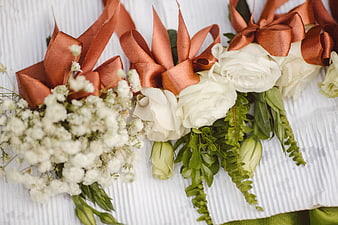 White Roses and Baby's Breath Wedding Boutonnieres with Copper Ribbons