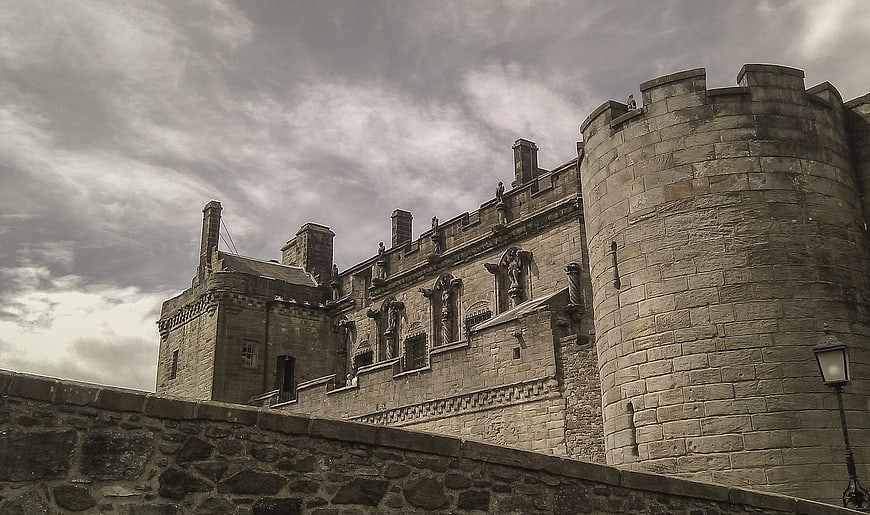 Sepia-toned Stirling Castle stone architecture and cloudy sky