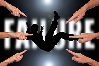 Silhouette of falling person surrounded by pointing fingers and failure text