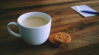 White Coffee Cup and Cookies on Wooden Table