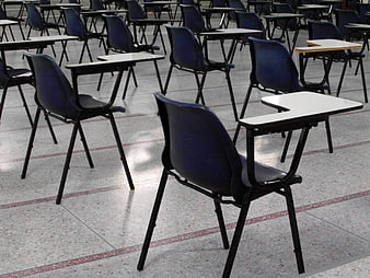 Empty Classroom with Blue Desks and Chairs