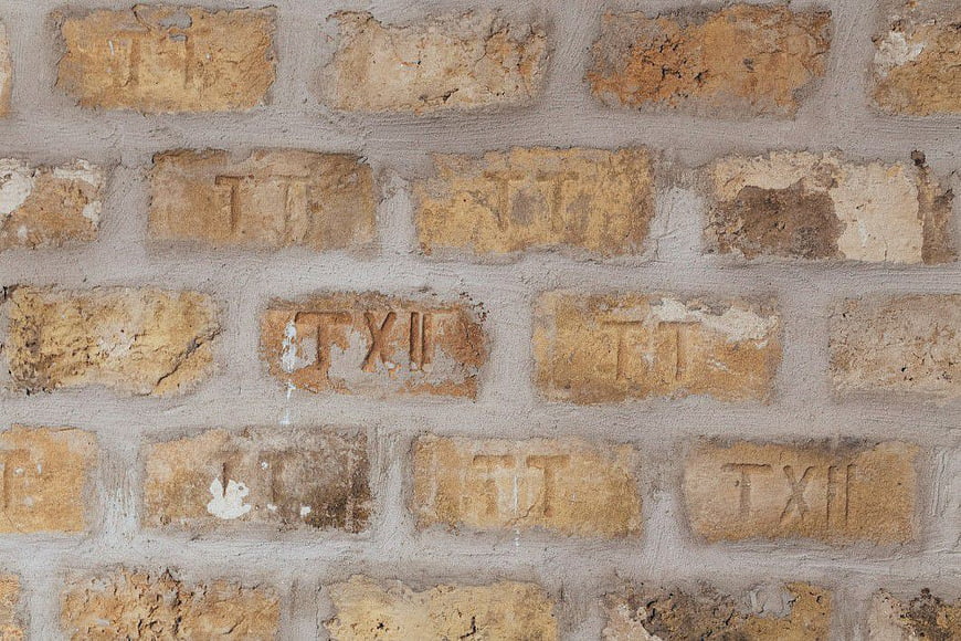 Closeup of Weathered Yellow Brick Wall Texture