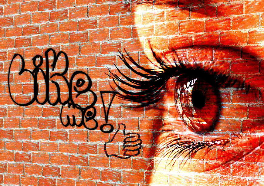 Like Me Graffiti on Brick Wall with Eye Overlay