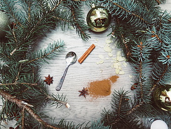 Christmas baking ingredients with pine branches and ornaments