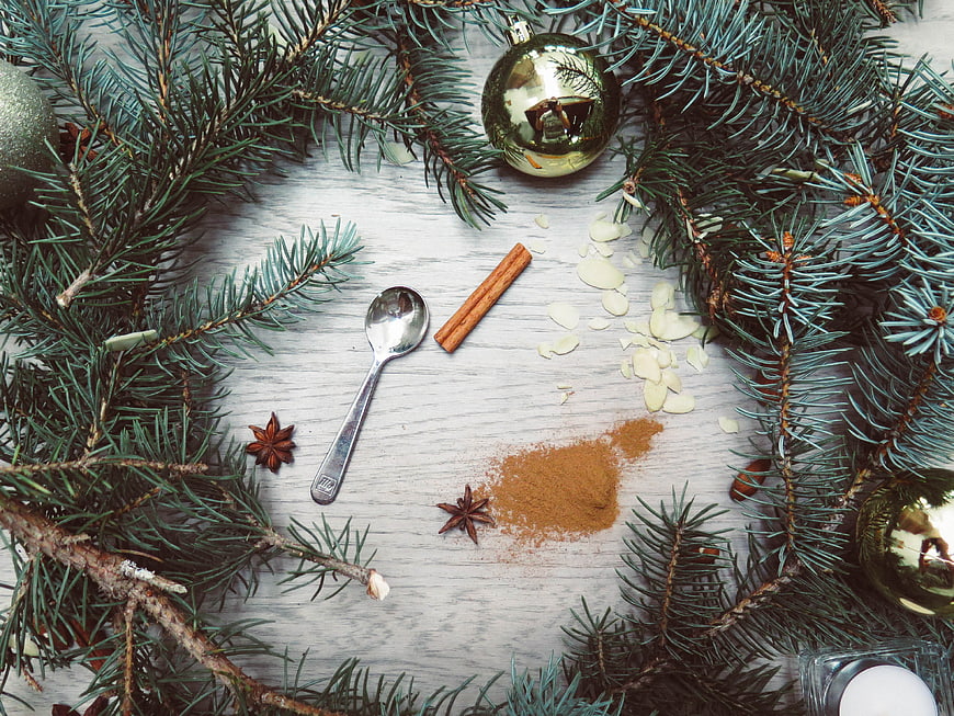 Christmas baking ingredients with pine branches and ornaments