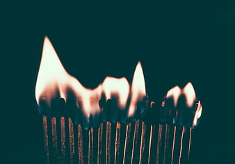 Burning Matches with Dramatic Flames on Dark Background