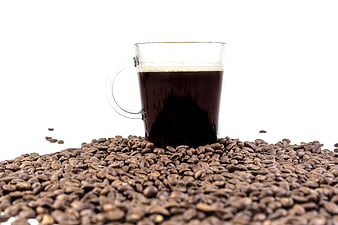 Glass Cup of Black Coffee Surrounded by Roasted Coffee Beans