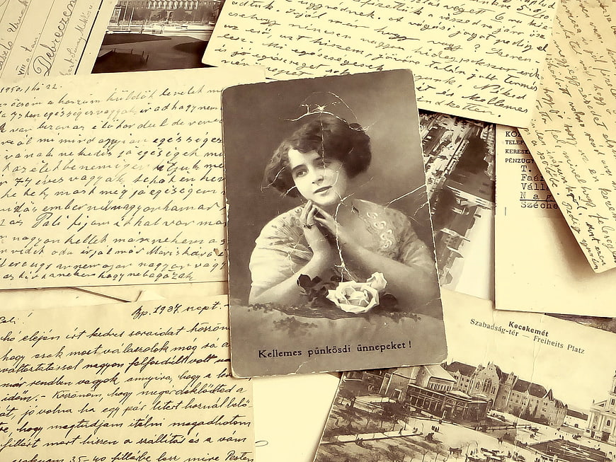Vintage Sepia Postcard with Woman Portrait and Handwritten Letters