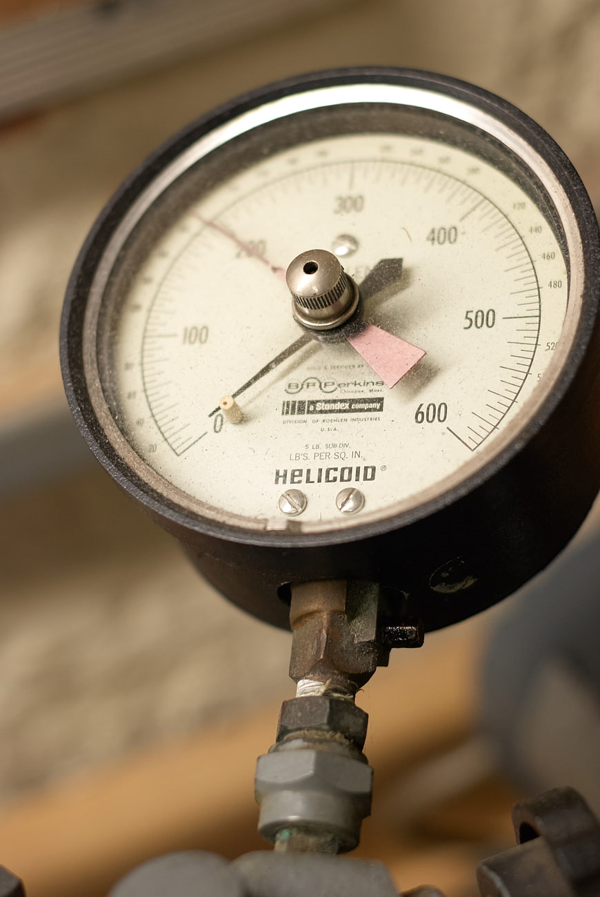 Close-up of vintage industrial pressure gauge