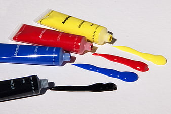 Tubes of Acrylic Paint with Colorful Squeezes on White Background