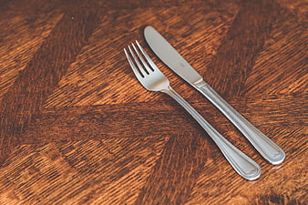 Silver Fork and Knife on Wooden Table