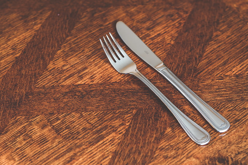 Silver Fork and Knife on Wooden Table