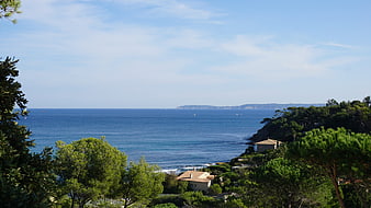 Scenic Mediterranean Coastline with Blue Sea and Green Hills