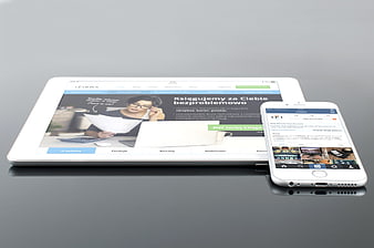 White tablet and smartphone mockup on gray surface