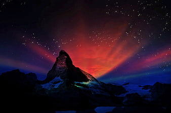 Matterhorn Mountain Silhouette Under Vibrant Red and Purple Aurora Night Sky