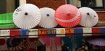 Traditional Japanese Paper Umbrellas Displayed On Shop Awning