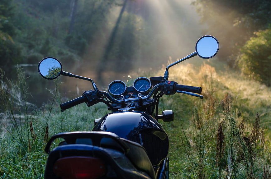 Motorcycle Handlebars in Misty Forest Morning Light