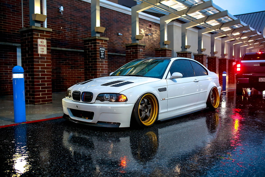 White BMW M3 E46 Stance Car on Wet Pavement