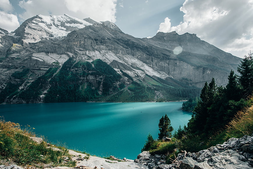 Turquoise Alpine Lake with Snow-Capped Mountains