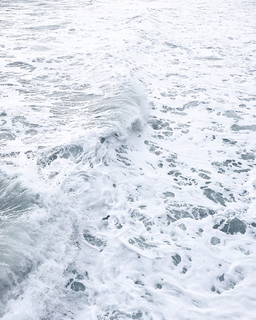 Aerial View of White Sea Foam and Ocean Waves