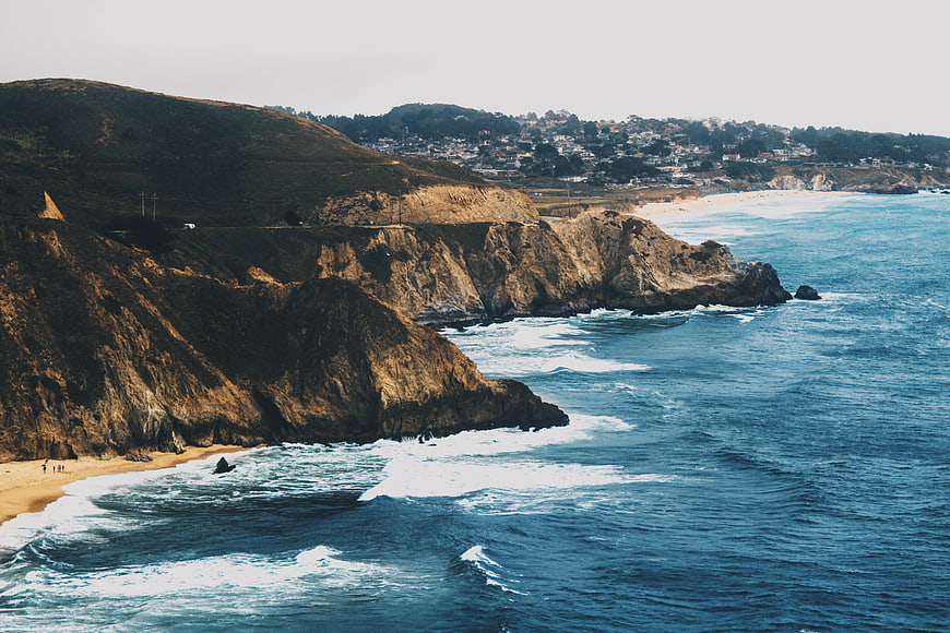 Aerial View of Dramatic Coastal Cliffs and Blue Ocean Waves