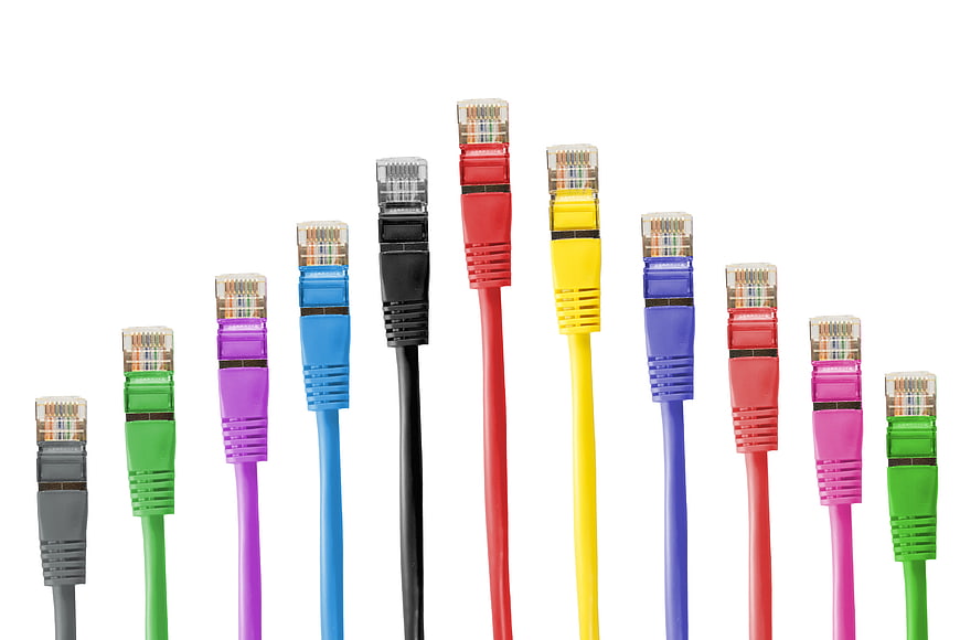 Colorful Ethernet Cable Connectors Arranged In A Row On White Background