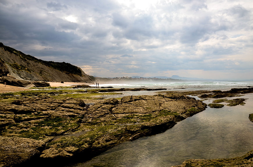 Dramatic Rocky Coastline with Tide Pools and Cloudy Sky