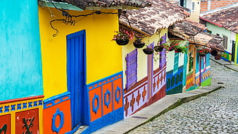 Colorful colonial houses on cobblestone street in Colombia
