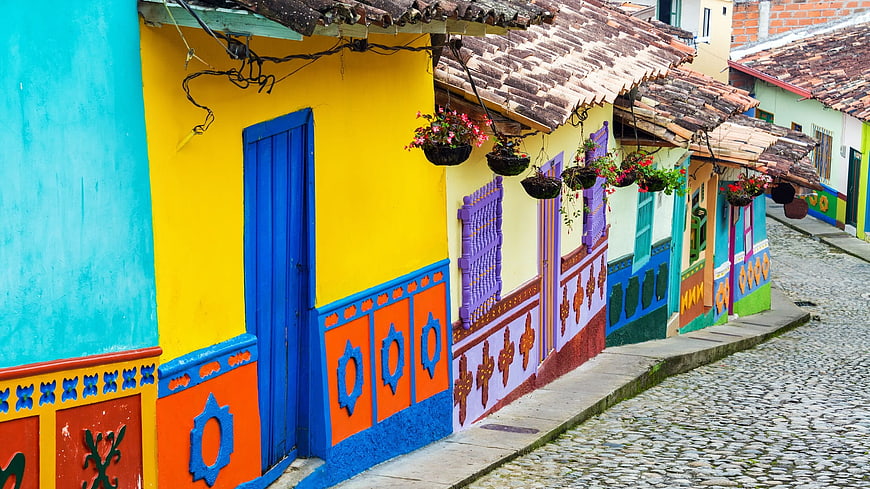 Colorful colonial houses on cobblestone street in Colombia