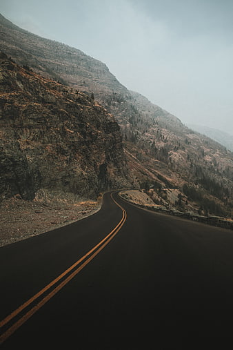 Winding Mountain Road Through Rocky Landscape