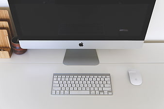 Minimalist Apple iMac Workspace on White Desk