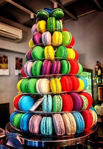 Colorful macaron tower on glass display stand