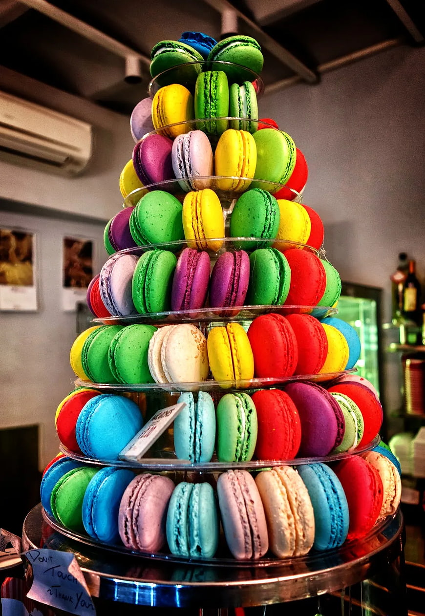 Colorful macaron tower on glass display stand