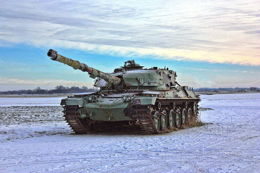 Military Tank On Snowy Field