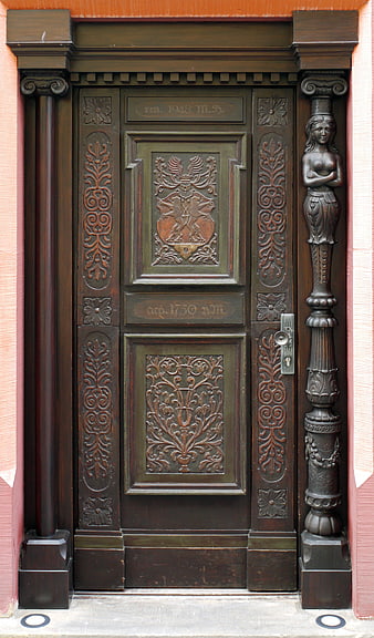 Ornate Historical Wooden Door with Carved Details