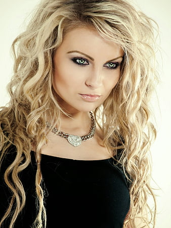 Portrait of Blonde Woman with Wavy Hair and Silver Necklace