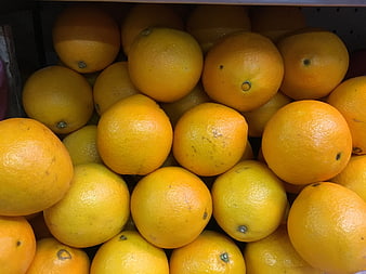 Fresh Oranges Piled in a Market Crate