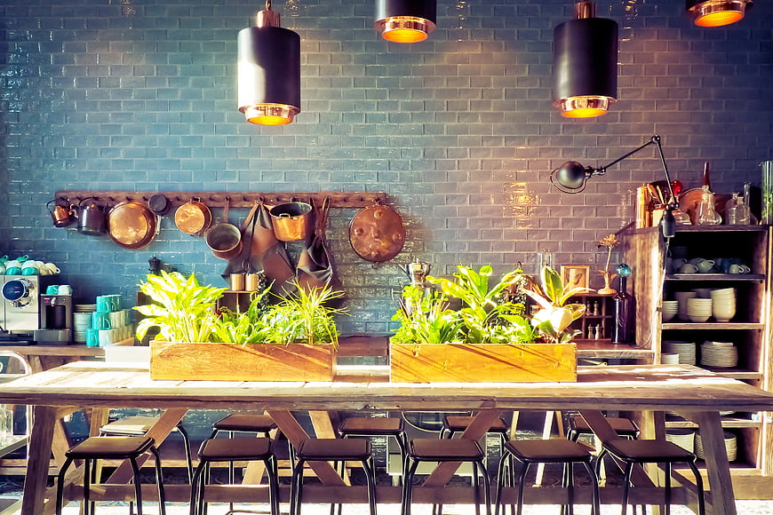 Modern Rustic Kitchen Interior With Blue Brick Wall And Green Plants