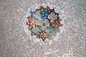 Colorful Gaudi Mosaic Detail on White Ceramic Tile Background