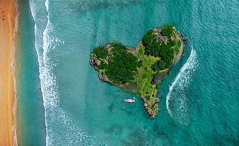 Aerial View of Heart-Shaped Island in Turquoise Ocean