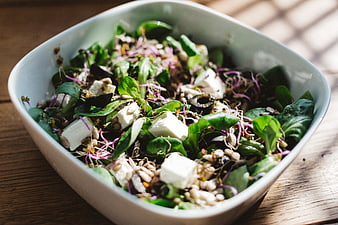 Healthy Green Salad with Feta Cheese and Sprouts in White Bowl
