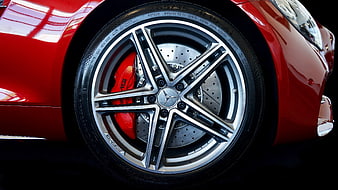 Close-up of red Mercedes-AMG car wheel with brake caliper