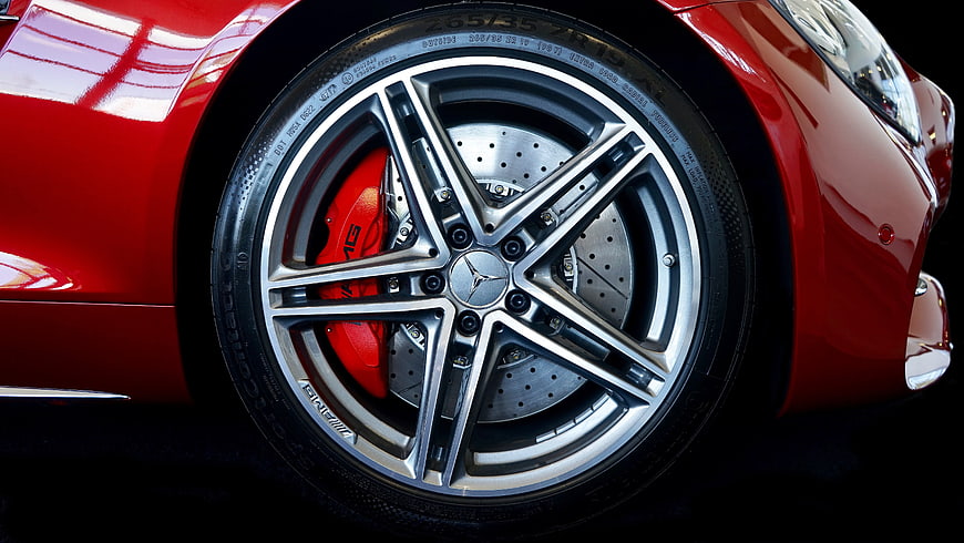 Close-up of red Mercedes-AMG car wheel with brake caliper